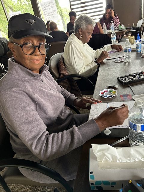 Man painting at a table