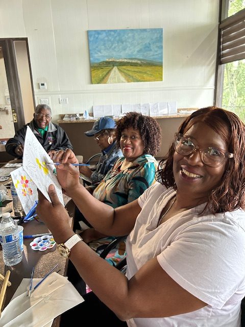 Woman holding a canvas to paint